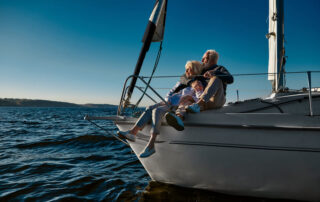 wealthy mature couple on sailing yacht