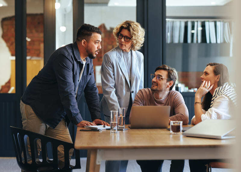 Business people around a meeting table